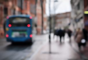 blurred-cityscape-featuring-bus-and-pedestrians-2026-09-24-21-08-41-utc
