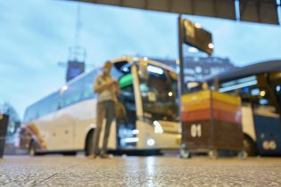 Uruguay, Montevideo, woman standing at bus stop